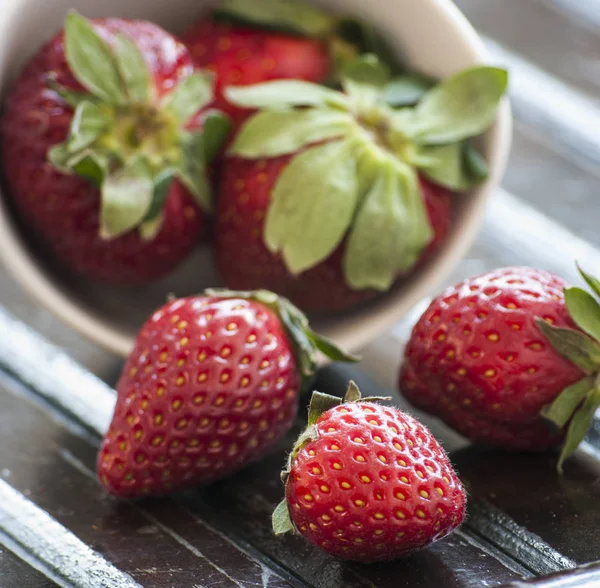 Strawberry on a dark wood background — Stock Photo, Image
