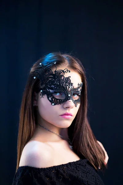 young Mystic woman posing  in mask