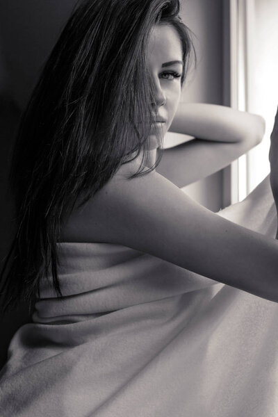 sexy woman lying on bed at home close up