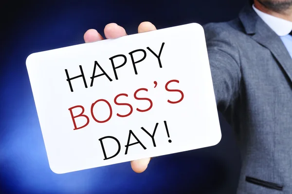 Man with a signboard with the text happy boss day — Stock Photo, Image