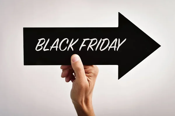 Text black friday in an arrow-shaped signboard — Stock Photo, Image