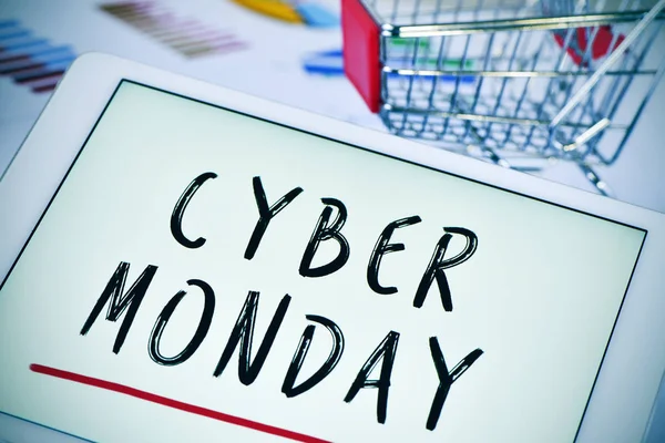 Text cyber monday in a tablet and a shopping cart — Stock Photo, Image