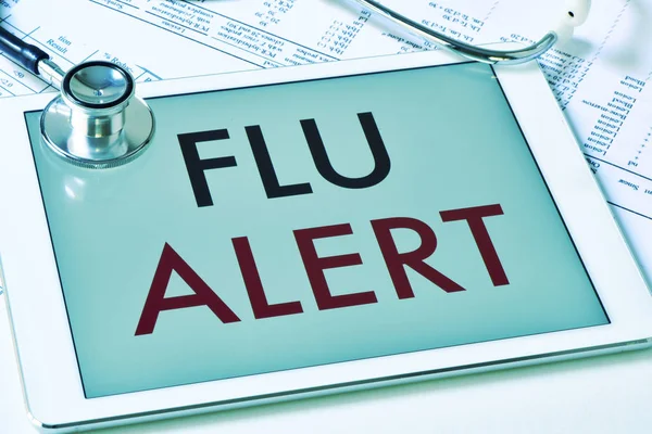 Text flu alert in a tablet computer — Stock Photo, Image