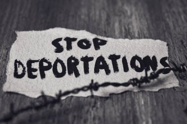 barbed wire and text stop deportations clipart