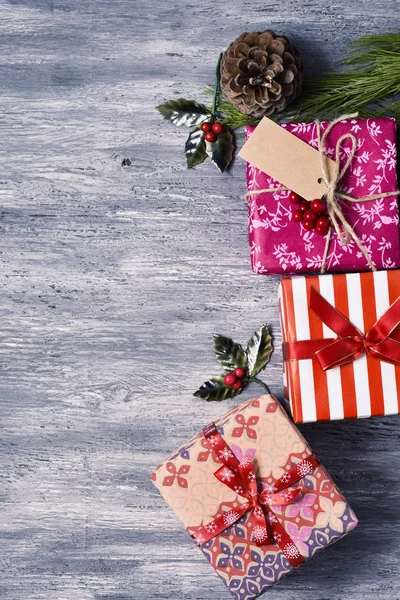 Christmas gifts on a wooden surface — Stock Photo, Image