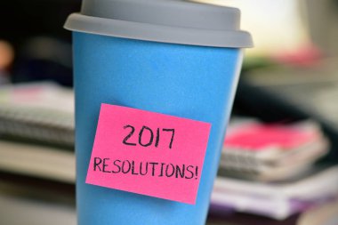 sticky note with text 2017 resolutions in a cup clipart