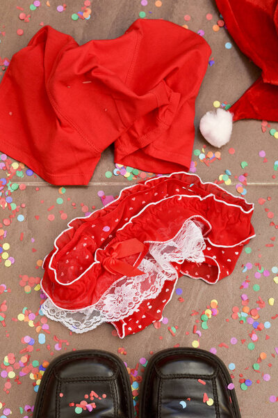 santa hat, shoes, red panties and underpants, and confetti