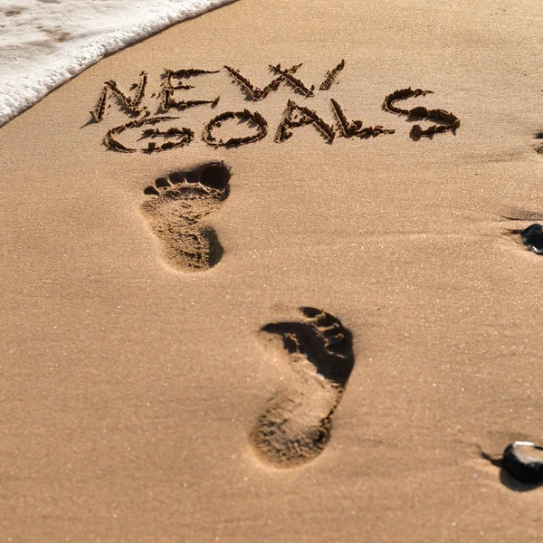 Text new goals in the sand of a beach — Stock Photo, Image