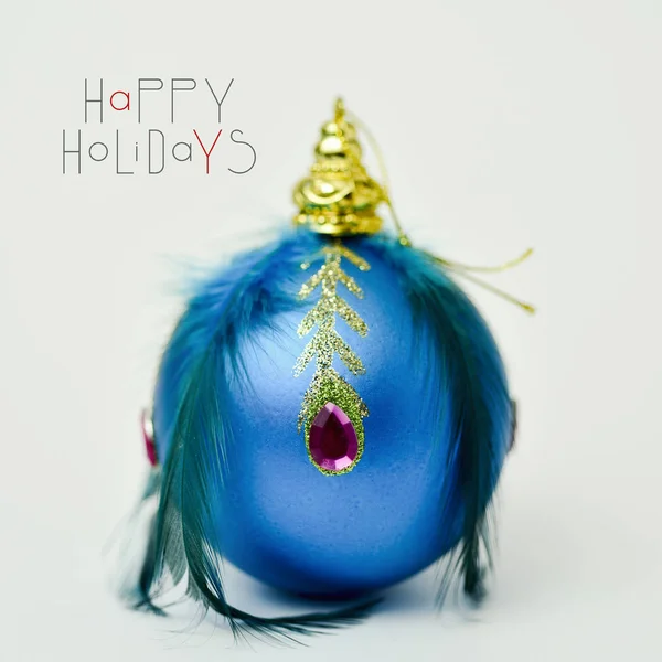 Elegant christmas ball and text happy holidays — Stock Photo, Image