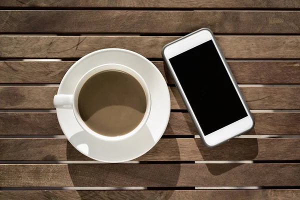 White coffee and smartphone — Stock Photo, Image