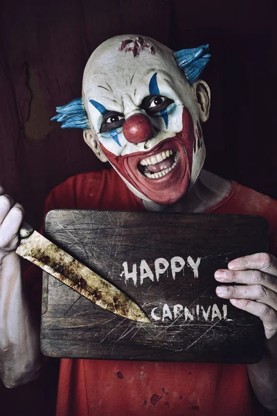 Zlý klaun a text šťastný karneval — Stock fotografie