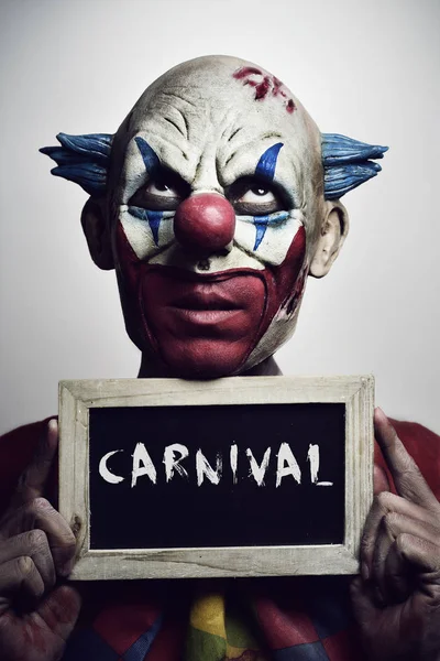 Zlý klaun a text karneval — Stock fotografie
