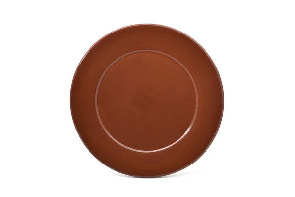 Пустая коричневая глиняная тарелка — стоковое фото
