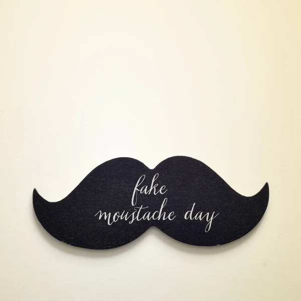 Text fake moustache day in a moustache — Stock Photo, Image