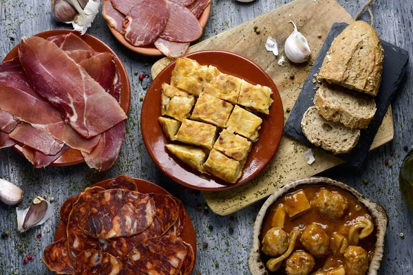 Assortment of spanish cold meats and tapas — Stock Photo, Image