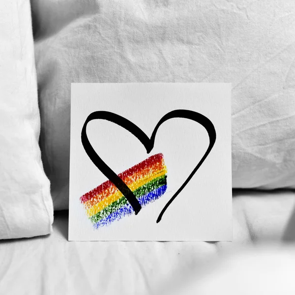 Rainbow and heart in a note — Stock Photo, Image