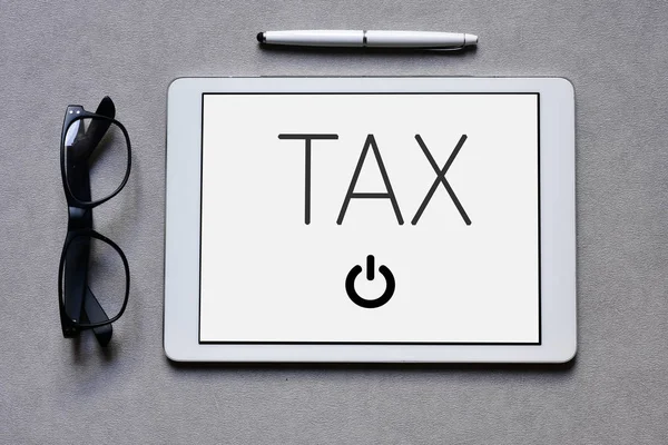 Word tax in a tablet computer — Stock Photo, Image