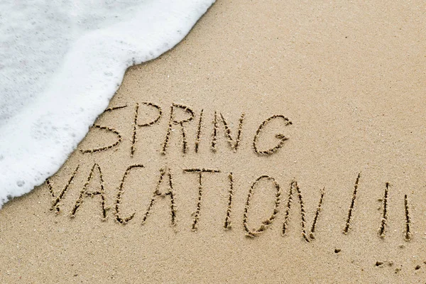 Text spring vacation in the sand of a beach — Stock Photo, Image