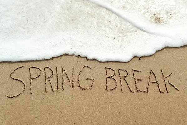 Text spring break in the sand of a beach — Stock Photo, Image