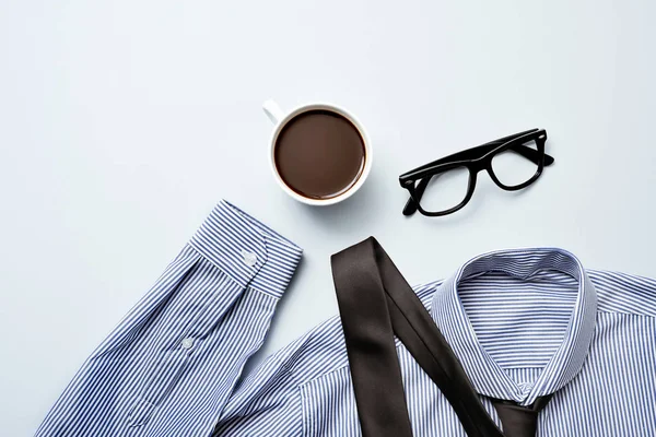 Coffee, eyeglasses, tie and shirt — Stock Photo, Image