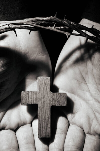 man with a cross and a crown of thorns