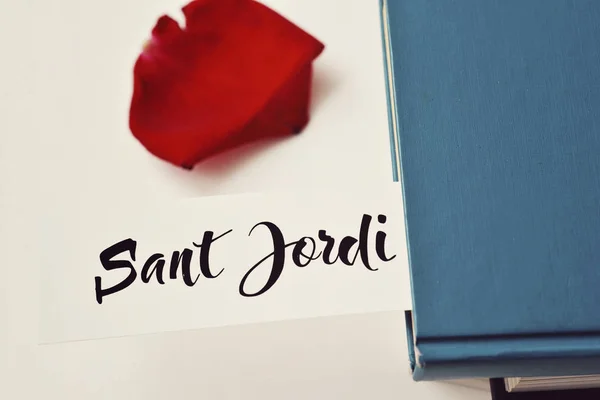 Books, red rose and text Sant Jordi — Stock Photo, Image