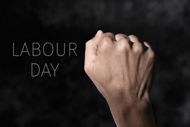 raised fist and text labour day clipart
