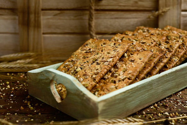 brown crackers topped with seeds