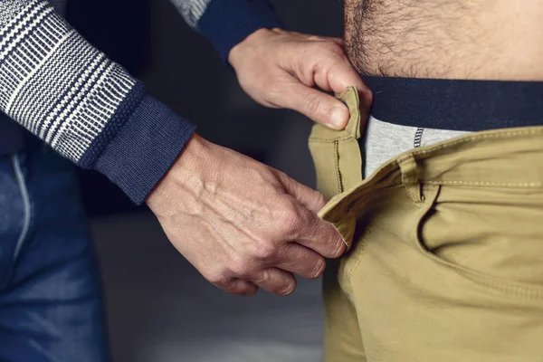 Man undressing another man — Stock Photo, Image