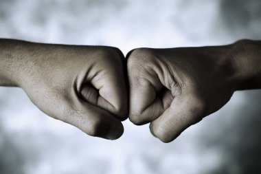two men fist bumping clipart