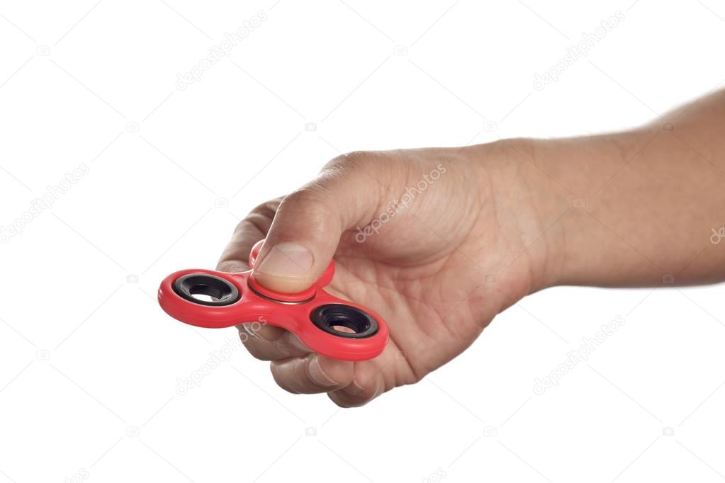young man playing with a fidget spinner