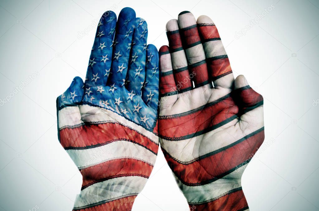 hands patterned with the US flag