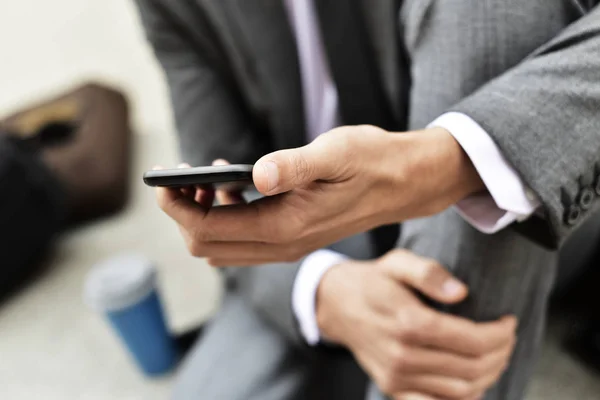 Young businessman using a smartphone — Stock Photo, Image