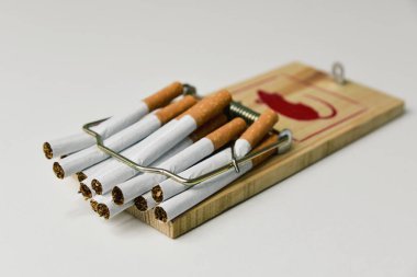 cigarettes in a mousetrap clipart