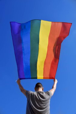 man with a rainbow flag clipart