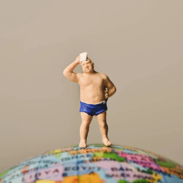 Miniature man in swimsuit — Stock Photo, Image