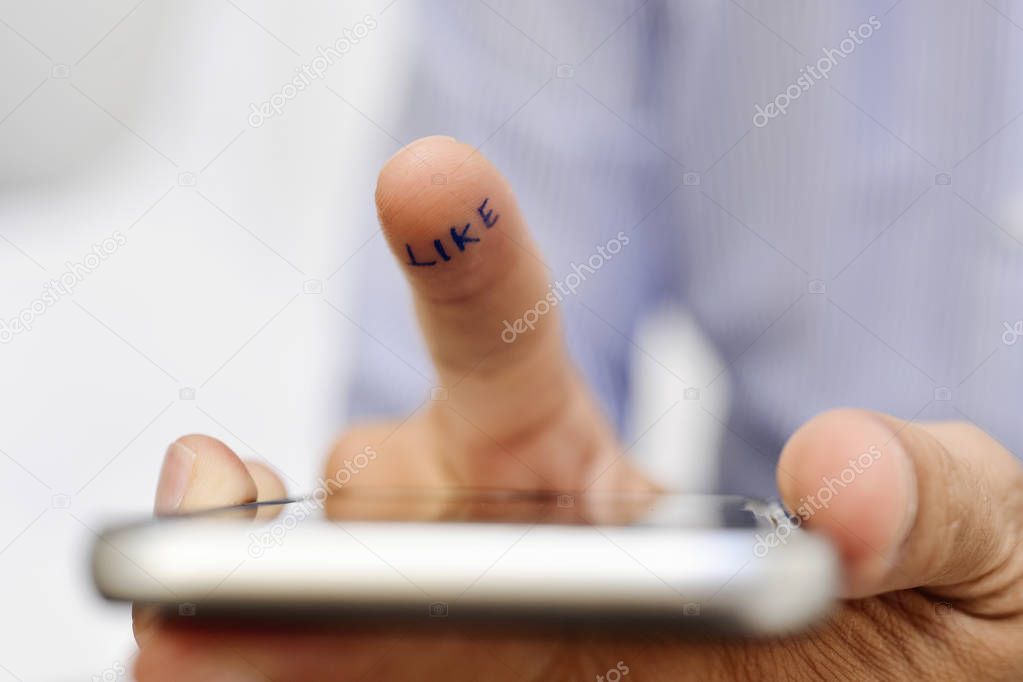 man with a smartphone and word like