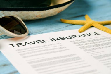 sunglasses, straw hat and travel insurance policy clipart
