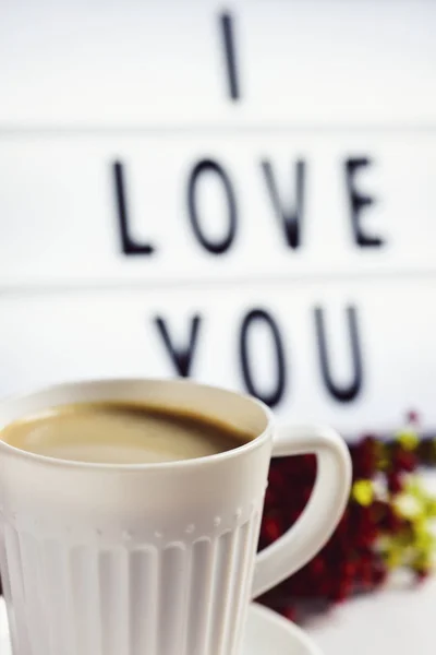 Чашка кави і тексту Я люблю тебе в лайтбоксі — стокове фото