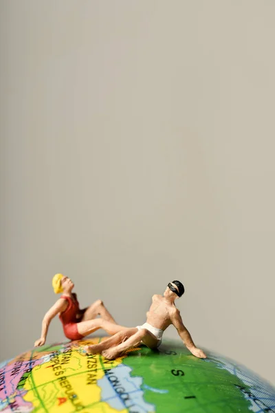 Miniature man dand woman in swimsuit — Stock Photo, Image