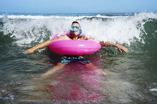 Man on the sea with diving mask and swim ring — Stock Photo, Image