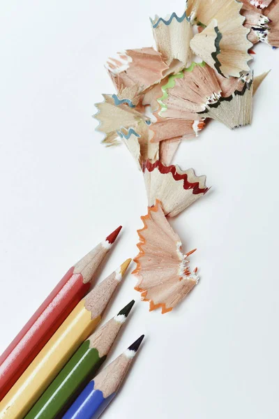 Pencil crayons and shavings of different colors — Stock Photo, Image