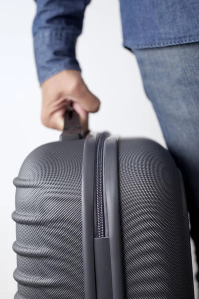 Young man carrying a suitcase — Stock Photo, Image