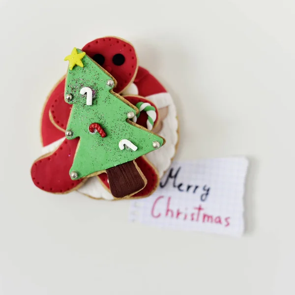 Christmas biscuits and text merry christmas — Stock Photo, Image