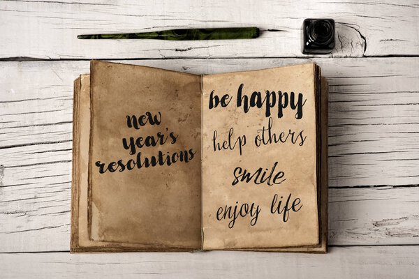 new years resolutions in a yellowish notebook