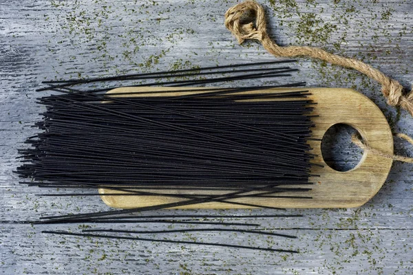 Uncooked black spaghetti — Stock Photo, Image