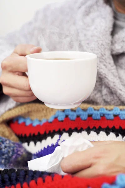 Ill man warming up with a cup of tea — Stock Photo, Image