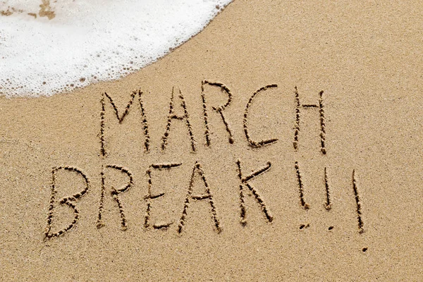 Text march break in the sand of a beach — Stock Photo, Image