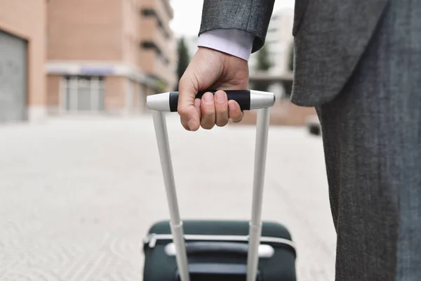 Businessman pulling a trolley case — Stock Photo, Image