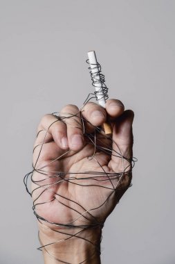 man hand and cigarette tied with wire clipart